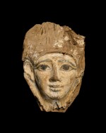 An Egyptian Wood Mummy Mask, 20th Dynasty, 1190-1075 B.C.