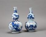 Two blue and white and iron red double gourd 'figural' vases, Qing dynasty, 17th century | 清十七世紀 青花礬紅彩人物故事紋葫蘆瓶兩件