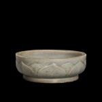 A Yue celadon 'lotus' shallow bowl Northern Song dynasty, dated Taiping dingcho year, corresponding to 977 | 北宋太平丁丑年（977年） 越窰青釉蓮瓣紋淺盌 《太平丁丑》款