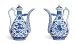 A rare pair of Ming-style blue and white ewers and covers Seal marks and period of Qianlong | 清乾隆 青花開光花果紋執壺一對 《大清乾隆年製》款