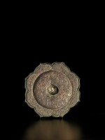 A rare gilt-silver-inset bronze mirror, Tang dynasty | 唐 嵌銀鎏金雙鳳狻猊紋銅鏡