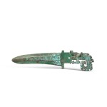 A rare turquoise-inlaid bronze 'dragon' dagger-axe, ge, Late Shang dynasty |  商末 青銅嵌綠松石曲內岐冠式龍紋戈