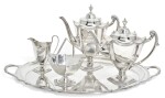 A MATCHED SILVER FOUR-PIECE TEA SERVICE AND TRAY, THE TEA SERVICE, WALKER & HALL, SHEFFIELD, 1911