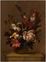Still life with tulips, anemones and other flowers in a vase, on a stone ledge