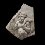 A Roman Marble Relief Fragment with Silenos, circa 2nd Century A.D.