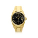 Reference 18038 Day-Date  A yellow gold automatic wristwatch with day, date, ferrite hardstone dial and bracelet, Circa 1986