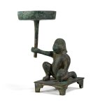 A bronze 'kneeling birdman' lamp, Han dynasty | 漢 青銅羽人形燈