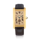 CARTIER | TANK AMERICAINE, REFERENCE 1735 1   A YELLOW GOLD WRISTWATCH WITH SALMON DIAL, MADE FOR KING OF SIAM, CIRCA 1990 " | 卡地亞 | Tank Americaine 型號1735 1 黃金腕錶，備鮭魚色錶盤，為暹羅國王而製，錶殼編號9312774，約1990年製"