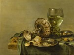 Still life with a roemer, an upturned tazza, nuts, acorns, a knife and a peeled and sliced lemon on a pewter plate