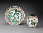 A wucai 'mythical beast' jar and a wucai 'pine' dish Ming dynasty, Wanli period | 明萬曆 五彩瑞獸紋罐及開光松樹圖盤一組兩件