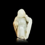 A white and russet jade figure of a foreigner, Qing dynasty, 18th - 19th century 清十八至十九世紀 白玉胡人像