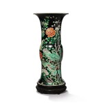 A famille-noire 'bird and flower' beaker vase, the porcelain 18th century, the enamels later-added | 清十八世紀 後加彩墨地五彩錦堂富貴圖花觚
