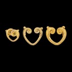Three gold double-scroll fertility earrings Java, Indonesia, 8th - 12th century | 八至十二世紀 印尼爪哇 金耳飾一組三件