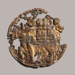 A gilt copper repoussé Buddhist plaque Tang dynasty | 唐 鎏金捶揲胡人犀牛圓牌