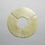 A pale celadon jade three-arc disc, bi, Neolithic period - early Shang dynasty | 新石器時代至商早期 青玉聯璜玉璧