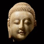 A superbly carved rare marble fragmentary head of Shakyamuni Buddha Northern Qi dynasty | 北齊 大理石釋迦牟尼佛首