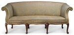  A GEORGE III STYLE CARVED MAHOGANY AND UPHOLSTERED SOFA, LATE 19TH/EARLY 20TH CENTURY, IN THE MANNER OF JOHN COBB