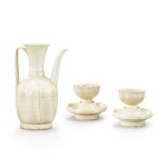 A Qingbai ewer and a pair of 'floral' cups and cup stands, Song dynasty 宋　青白釉執壺一件、剔花盃及盃托一對