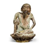 A celadon glazed figure of a rakan | Edo period, late 18th century