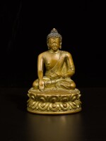 A small gilt-copper alloy figure of Shakyamuni Buddha Tibet, ca. 16th century | 西藏 約十六世紀 鎏金銅合金釋迦牟尼佛坐像