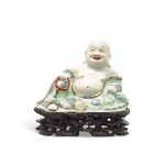 A famille-rose figure of Budai, Qing dynasty, 18th century 清十八世紀 粉彩彌勒佛坐像
