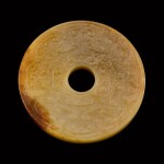 A yellow and russet jade archaistic bi disc Song - Ming dynasty | 宋至明 黃玉仿古璧