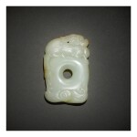 A FINE AND RARE WHITE AND RUSSET JADE 'QILIN' PENDANT,  QING DYNASTY, QIANLONG PERIOD
