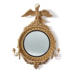 A REGENCY CARVED GILT AND EBONISED WOOD CONVEX MIRROR OF UNUSUAL SIZE, CIRCA 1810