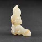 A WHITE JADE 'FOREIGNER AND DOG' GROUP PROBABLY QING DYNASTY | 或清 白玉胡人戲犬把件