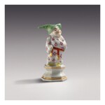 A MEISSEN FIGURE OF A DWARF, 'MONSIEUR PIPEROUK' THE PORCELAIN CIRCA 1725, THE DECORATION PROBABLY LATER
