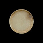 A jade circular appliqué, Han dynasty | 漢 玉飾
