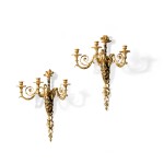 A pair of late Louis XV patinated and gilt-bronze three-light wall appliques, circa 1770, attributed to François Rémond