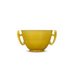 A yellow-glazed handled cup, Qing dynasty, 18th century | 清十八世紀 黃釉暗刻龍紋耳盃