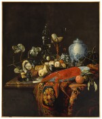 A monumental still life with fruit and various objects