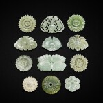 A group of twelve pale celadon jade and jadeite carved 'floral' plaques, Yuan - Ming dynasty 元至明 青白玉花形玉片十一件及翠玉花形玉片一件