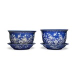 A pair of slip-decorated blue-ground 'bird and flower' jardinières, 19th / 20th century