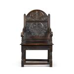 A Charles II carved oak panel back armchair, Lancashire/North Cheshire, circa 1680