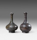 Two archaic garlic-head bronze vases Ming dynasty or earlier | 明或更早期 銅蒜頭瓶一對