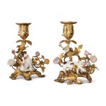 TWO MEISSEN FIGURES OF A PUG AND A CAT MOUNTED ON GILT-BRONZE CANDLESTICKS, THE PORCELAIN AND MOUNTS, MID-18TH CENTURY