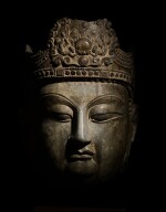A monumental and extremely rare limestone head of Vairocana Buddha, Tang dynasty |  唐 石灰岩雕寶冠佛首