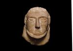 A SOUTH ARABIAN RELIEF HEAD OF A MAN, SABAEAN, 4TH/3RD CENTURY B. C.