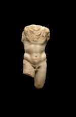 A ROMAN MARBLE TORSO OF A GOD OR HERO, CIRCA 2ND CENTURY A.D.