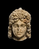 A Roman Marble Janiform Herm of Dionysos or Apollo, circa 2nd Century A.D.