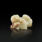 A white and russet jade 'Buddhist lion' group, Qing dynasty |  清 白玉太獅少獅