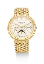PATEK PHILIPPE | REFERENCE 3945, A YELLOW GOLD PERPETUAL CALENDAR BRACELET WATCH WITH MOON PHASES, 24 HOUR AND LEAP YEAR INDICATION, CIRCA 1993