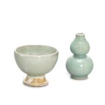 A Yaozhou moon-white glazed 'fish' stem cup and   a small Longquan celadon double-gourd vase,  Song - Yuan dynasty  宋至元 耀州月白釉印魚紋高足盃 及 龍泉青釉葫蘆小瓶