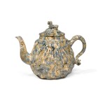  A Staffordshire Sold-Agate Pecten-Shell Teapot and Cover, Circa 1750