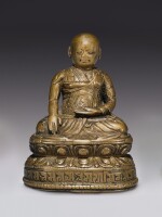  A COPPER ALLOY FIGURE OF A LAMA WITH COPPER INLAY,  TIBET, 16TH CENTURY 