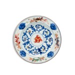 A blue and white polychrome-enamelled 'fish' dish, Qing dynasty, Kangxi period | 清康熙 青花加彩纏枝蓮魚紋盤
