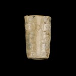 A cylindrical jade 'taotie' bead, Shang dynasty | 商 饕餮紋玉管